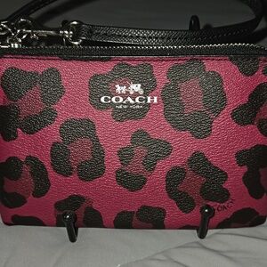 Coach Oselot Corner Zip Wristlet featuring an leopard print red and black. RARE
